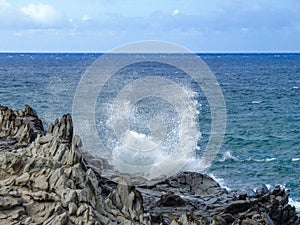 Coastline and rugged lava rocks called DragonÃ¢â¬â¢s Teeth and crashing waves at Makaluapuna Point near Kapalua, Maui, HI, USA